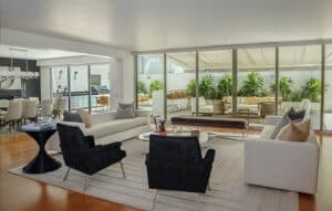 Beautiful living room, dining room, and a patio.