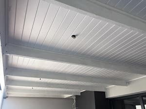 Isoboard fitted between exposed beams