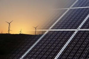 Wind turbines on the left and solar panels on the right, as one of the best home renewable energy options